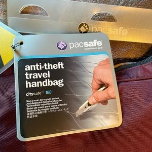 Pacsafe anti-theft travel handbag